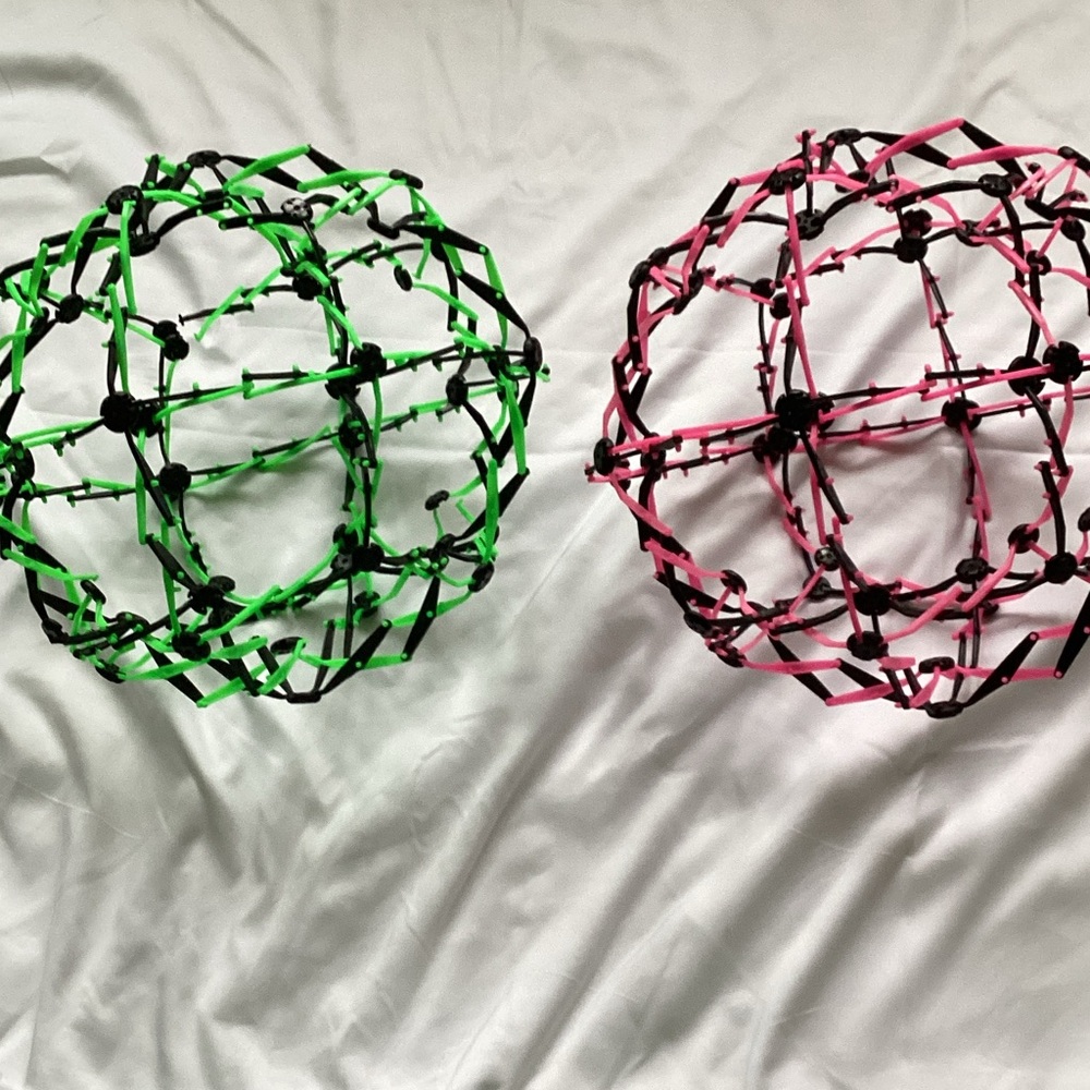 Two Expandable Green and Pink Sphere Toys - Picture 3 of 3